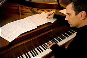 Dan composing at his piano in Plymouth MI